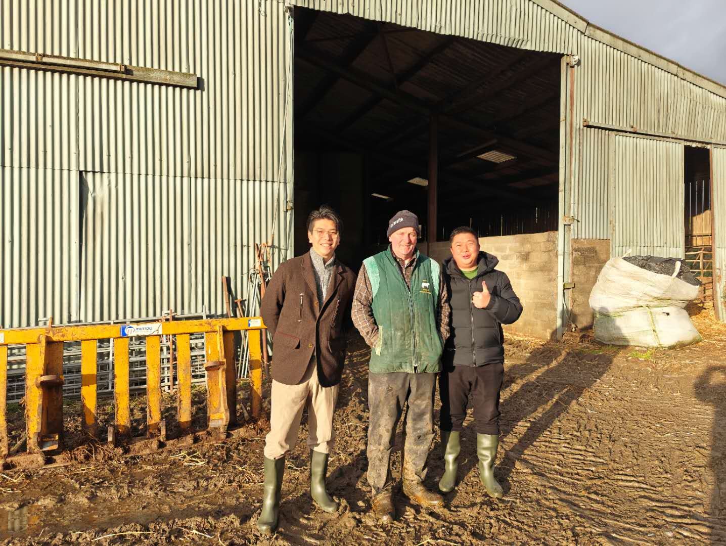 Members of a company delegation visiting a UK farm