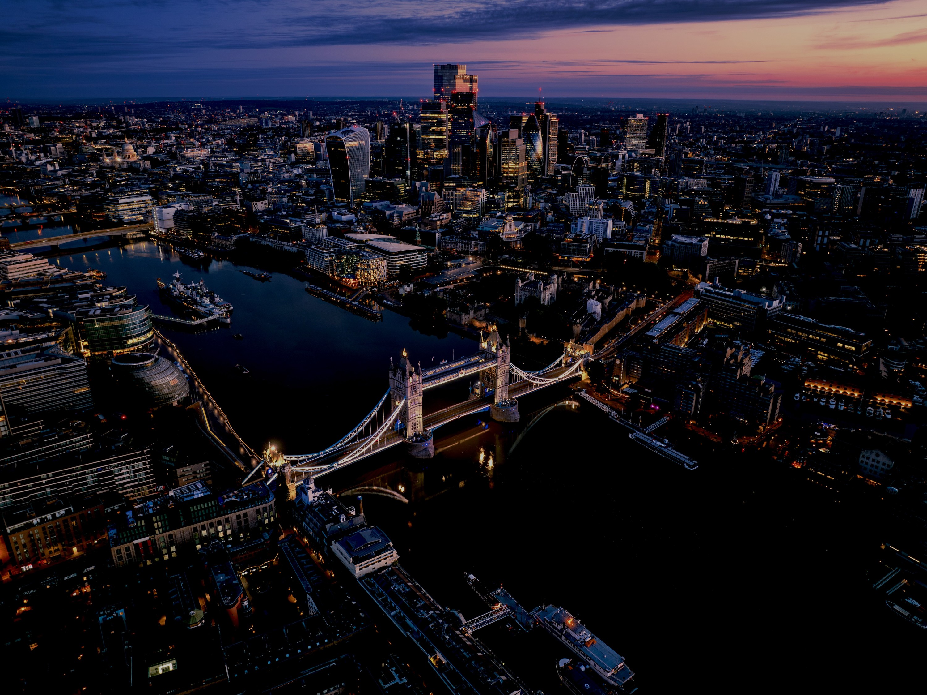 Tower Bridge and the London skyline at dusk
